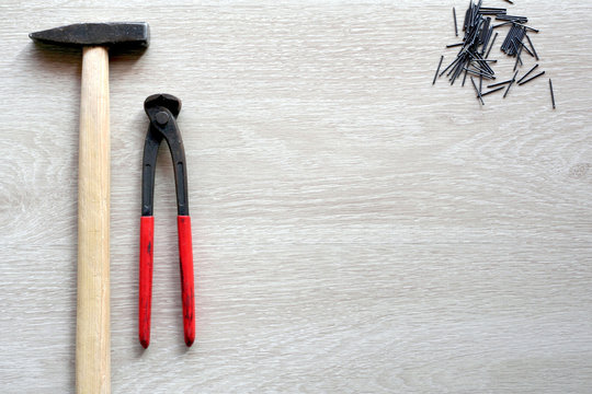 Carpenter tools with wooden background. Top view with copy space