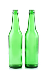 green glass bottles on white isolated background