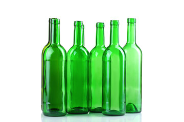 green glass bottles on white isolated background