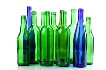 green glass bottles on white isolated background