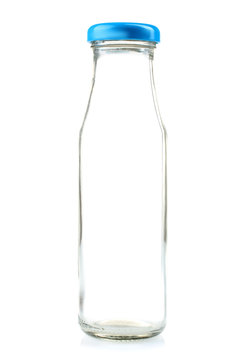 transparent glass bottle of milk on a white isolated background