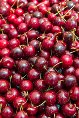 Ripe red cherries in the market on the counter