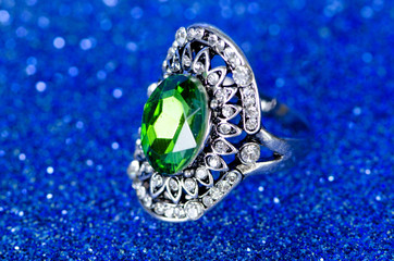 Jewellery ring against blue background