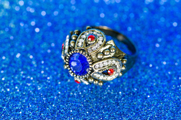 Fototapeta premium Jewellery ring against blue background