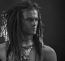 Young man's portrait. Stylish handsome sexy Guy with Dreadlocks