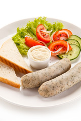 Breakfast - boiled white sausages, toasts and vegetables 