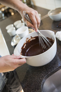 Sweden, Sodermanland, Alvsjo, Man preparing chocolate souffle