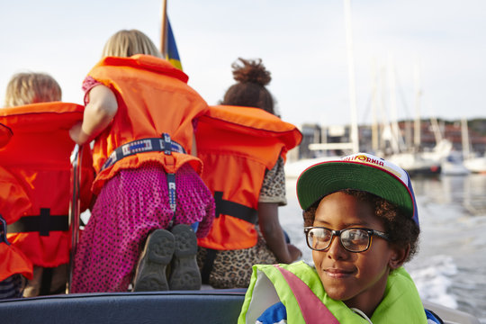 Sweden, Swedish West Coast, Vastra Gotaland, Children (6-7, 10-11) on tour boat
