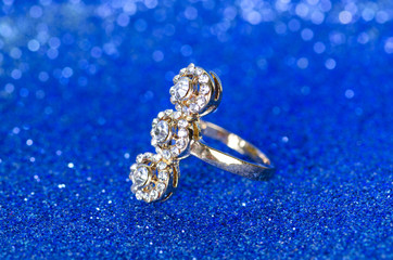 Jewellery ring against blue background