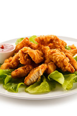 Fried chicken nuggets and vegetables 