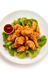Fried chicken nuggets and vegetables 