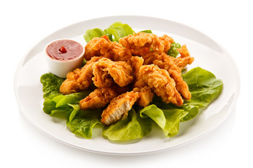 Fototapeta premium Fried chicken nuggets and vegetables 