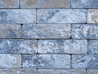 Rough brick wall of earth and terracotta colored bricks in Germany 2016