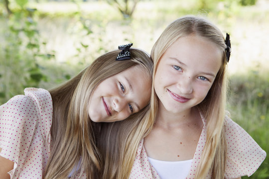 Portrait of smiling girls standing outdoors
