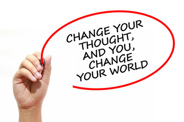 Man writing CHANGE YOUR THOUGHT, AND YOU, CHANGE YOUR WORLD with marker on transparent wipe board.