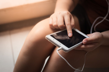 Woman using smartphone in cafe