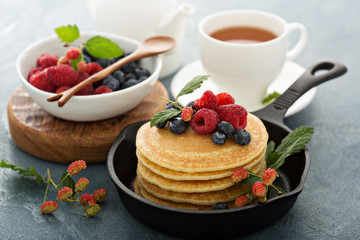 Fluffy buttermilk pancakes with fresh berries