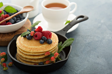Fluffy buttermilk pancakes with fresh berries