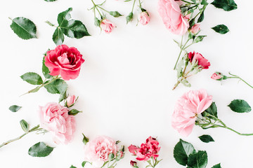 round frame wreath pattern with roses, pink flower buds, branches and leaves isolated on white background. flat lay, top view