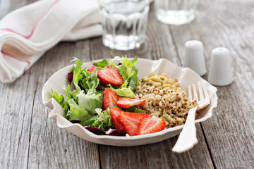 Quinoa salad with strawberries and greens