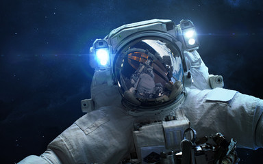 Astronaut in outer space. Spacewalk. Elements of this image furnished by NASA