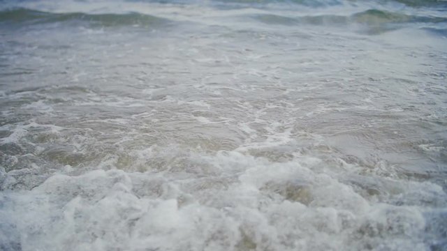 Small waves goes on camera in slow-motion