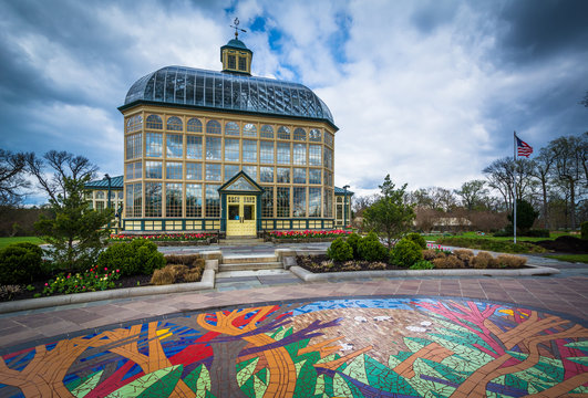 Mural on the ground and the Howard Peters Rawlings Conservatory