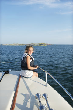 Sweden, Sodermanland, Stockholm Archipelago, Norsten, Portrait of girl (12-13) on boat