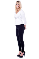 Fototapeta premium Businesswoman standing with her arms behind her back