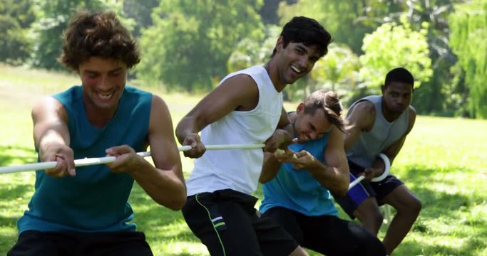 Men pulling a rope in a tug of war