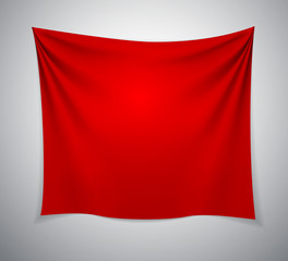Red textile cloth banner with folds.