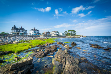 Rocky coast and beachfront homes at Concord Point, in Rye, New H © jonbilous
