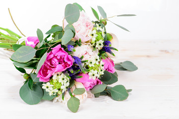 Summer Field bouquet on wooden white background, space for text