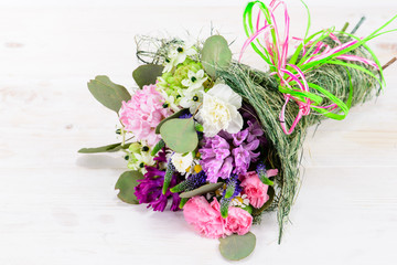 Summer Field bouquet on wooden white background, space for text