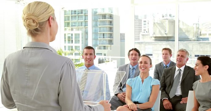 Video of businesswoman asking question during conference