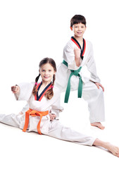 Two children athletes martial art taekwondo training