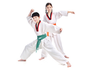 Two children athletes martial art taekwondo training