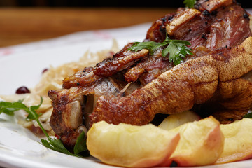 fried pork knuckle with potatoes and cabbage