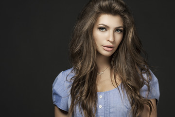 Portrait of beautiful young woman with long straight brown hair