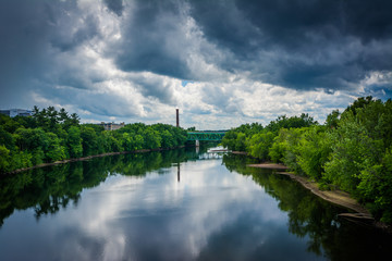 Fototapeta na wymiar Storm clouds over the Merrimack River, in Manchester, New Hamps