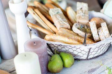 a variety of cookies in a basket on an old table