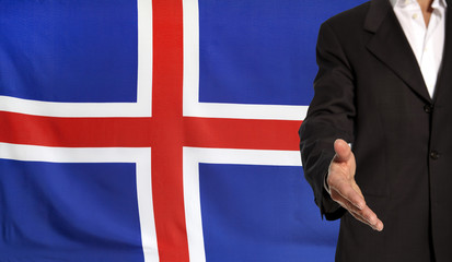 Open hand and Iceland flag in the background