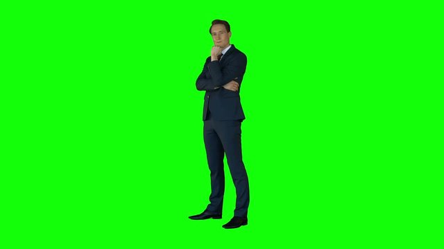 Businessman thinking on green screen 