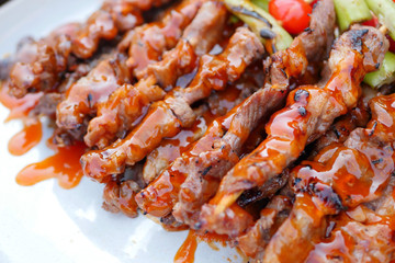 grilled bbq or barbecue stacked on plate