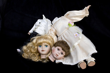 Girl and Boy Doll broken wedding body on black background