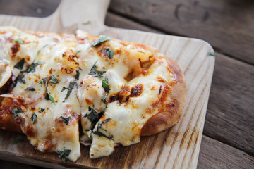 Pizza with seafood on wood background italian food