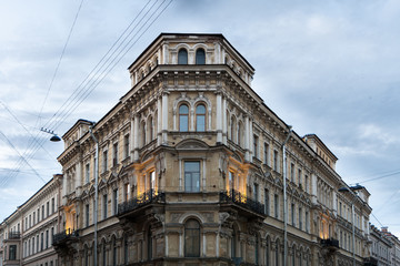 Fototapeta na wymiar Classic corner building with balconies and columns on Voznesensky Prospect