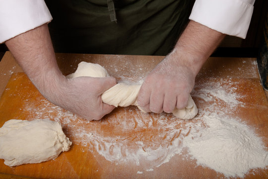 The process of making home bread by male hands
