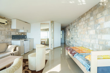 Interior of a guest house living room with kitchen