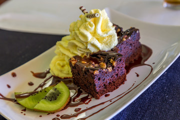 Delicious chocolate cakes on table close-up